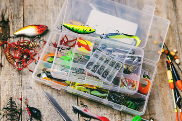 accessories for fishing on a wooden background. selective focus.
