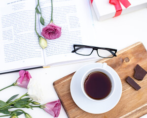 Short break from business work, beautiful picture for post in Instagram. Relax and have cup of coffee, read interesting book, prepare white gift box. Enjoy your free minutes. Layout.