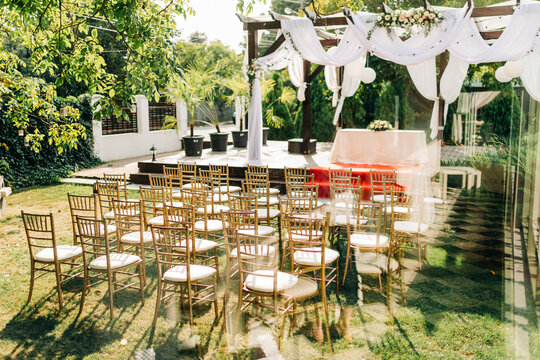 Golden chiavari chairs for outdoor garden wedding