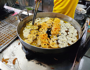 Jalebi making by confectioner. An Indian Sweet.
