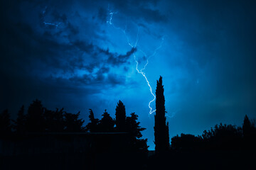 thunderstorm illuminates a dark night