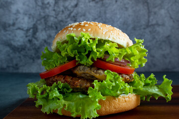 Homemade hamburger with delicious fresh vegetables.