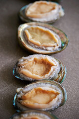 Raw abalone washed clean on marble 