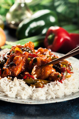Sweet and sour chicken with colorful bell pepper with rice