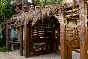 Fototapeta na wymiar Old wooden doors at the beautiful tropical garden