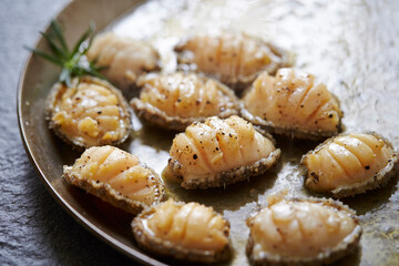 Grilled fresh abalone on a cast iron pan
