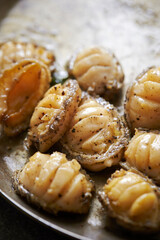 Grilled fresh abalone on a cast iron pan