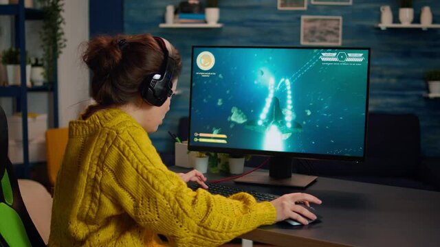 Esport of pro gamer playing video game with new graphics winning championship, stylish design cyber games room. Virtual shooter game in cyberspace, esports player performing on pc gaming tournament