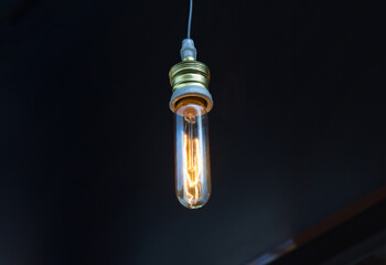 vintage light bulb on black background. Edison lightbulb on dark background