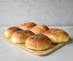 fresh baked buns with sesame and poppy  seeds