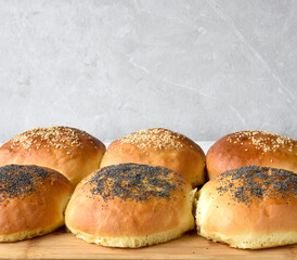 fresh baked buns with sesame and poppy  seeds