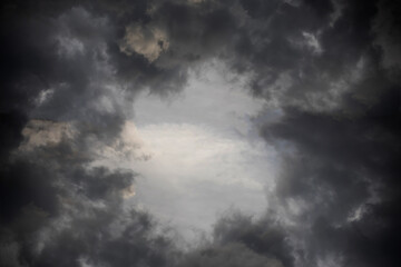 Naklejka na ściany i meble twirl dark cloud background and texture. hole on dramatic storm cloud.