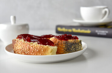 cup of tea (coffee) with bun and jam