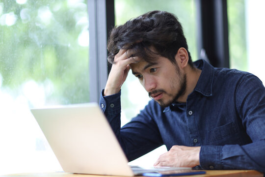 Young man asia tired man under stress in the office