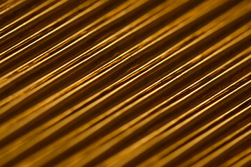 Abstract stylish geometric background. Growing diagonals. Trendy gold and dark colors.