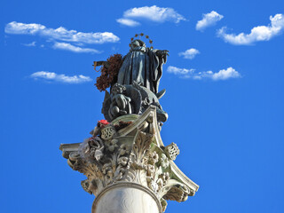 Zoom detail photo of Column of the Immaculate Conception near iconic Piazza di Spagna, Rome, Italy