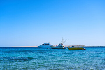 Tourist boats in the Red Sea. Beautiful clear sea water