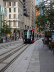 Fototapeta na wymiar Tram moving through George St in Sydney NSW Australia