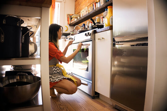 Woman baking in kitchen at home