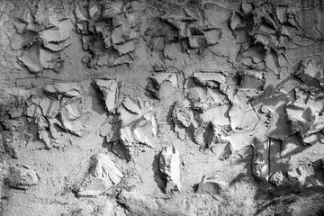 texture of a grey wall covered with volumetric plaster, space for text, space for copy