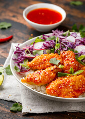 Korean Fried chicken with red cabbage salad and white rice. Asian food