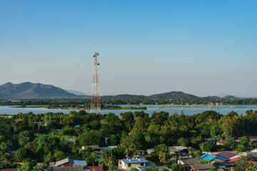 The Communication Pole in the Village, Lake and Mountain Background