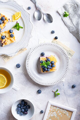 Flat lay of cake with blueberries and cottage cheese