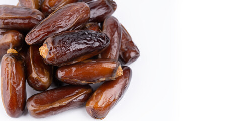 Creative layout made of dried dates. Flat lay. Food concept. Fruits dates. Dates Palm fruit isolated on white. Dried fruits. Healthy diet.