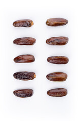 Creative layout made of dried dates. Flat lay. Food concept. Fruits dates. Dates Palm fruit isolated on white. Dried fruits. Healthy diet.