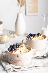Morning breakfast with oatmeal porridge and blueberries