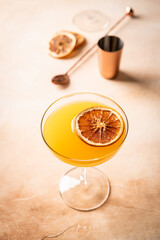 Fresh tall glass of tropical cocktail with rum and orange juice garnished with dry orange
