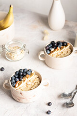 Morning breakfast with oatmeal porridge and blueberries