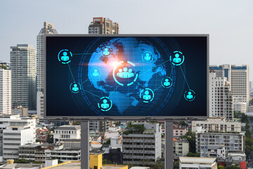 World planet Earth map hologram and social media icons on billboard over panorama city view of Bangkok, Southeast Asia. The concept of people networking and connections.