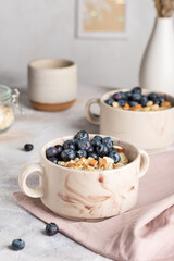 Morning breakfast with oatmeal porridge and blueberries