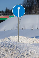 Road signs for drivers cars on the road, on a winter sunny day