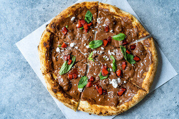 Sweet Pizza with Chocolate, Strawberries, Meringues and Mint Leaves.