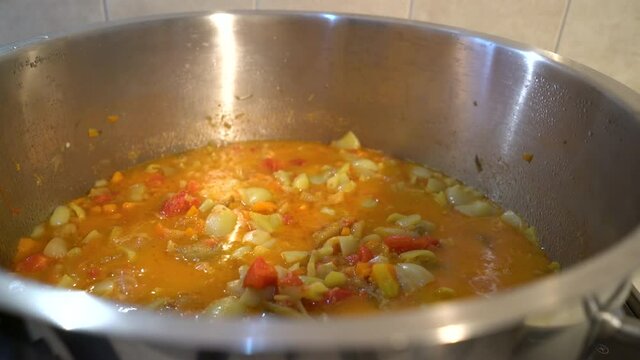 Cooking homemade G&uuml;ve&ccedil; in pot - (4K)