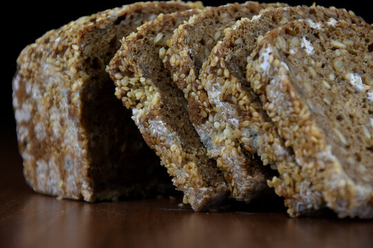 Moldy whole wheat bread close up stock images. Moldy sliced bread images. Spoiled food close up photo
