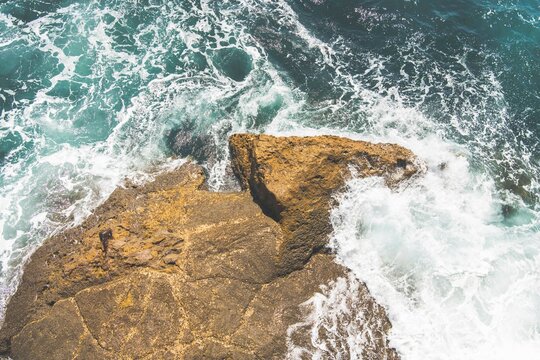 Waves crashing against a rock