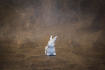 Easter bunny on rustic broun background
