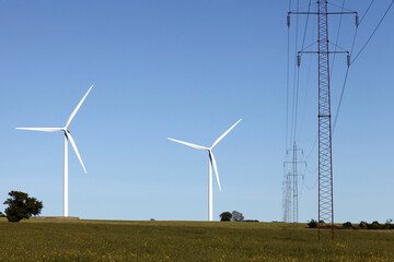 Landscape with wind turbines and high voltage power line
