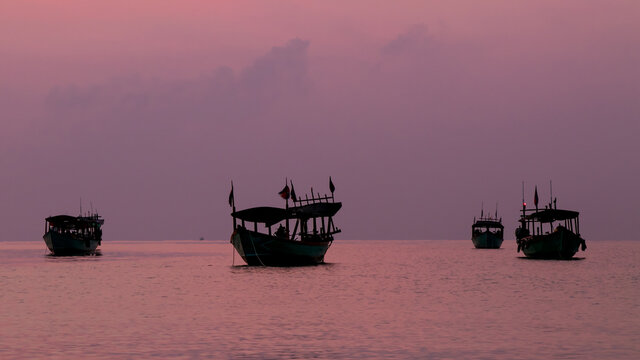 Koh Rong Island, Cambodia at Sunrise. strong vibrant Colors, Boats and Ocean
