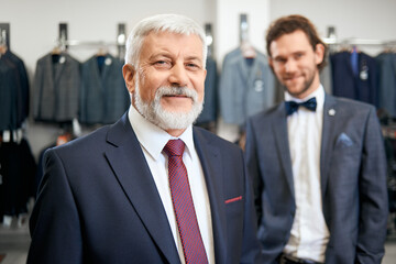 Two elegant men in store clothes.