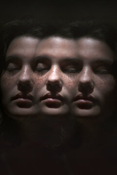 Close-up multiple image of teenage girl with eyes closed against black background