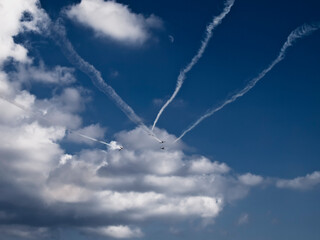 Mono propeller aircraft squadron flying in formation into a cloudy sky