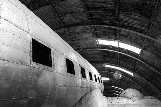 Old aircraft in restoration hangar