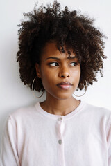 Portrait of a beautiful black woman with afro on the white background