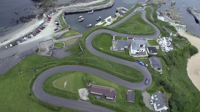 Ballintoy harbour is synonymous with Pyke and the Iron Islands.Theon is baptised here and Euron is drowned and reborn. The beach played host to Mellisandre's burning of Stannis Barratheon's bannerman