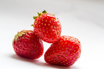 Strawberry in closeup on white background