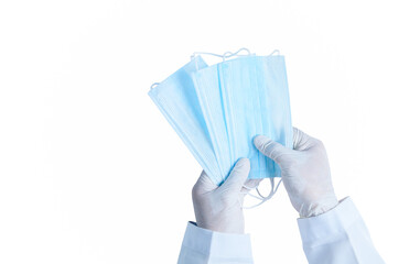 Doctor hands in medical gloves holding surgical  protective mask isolated